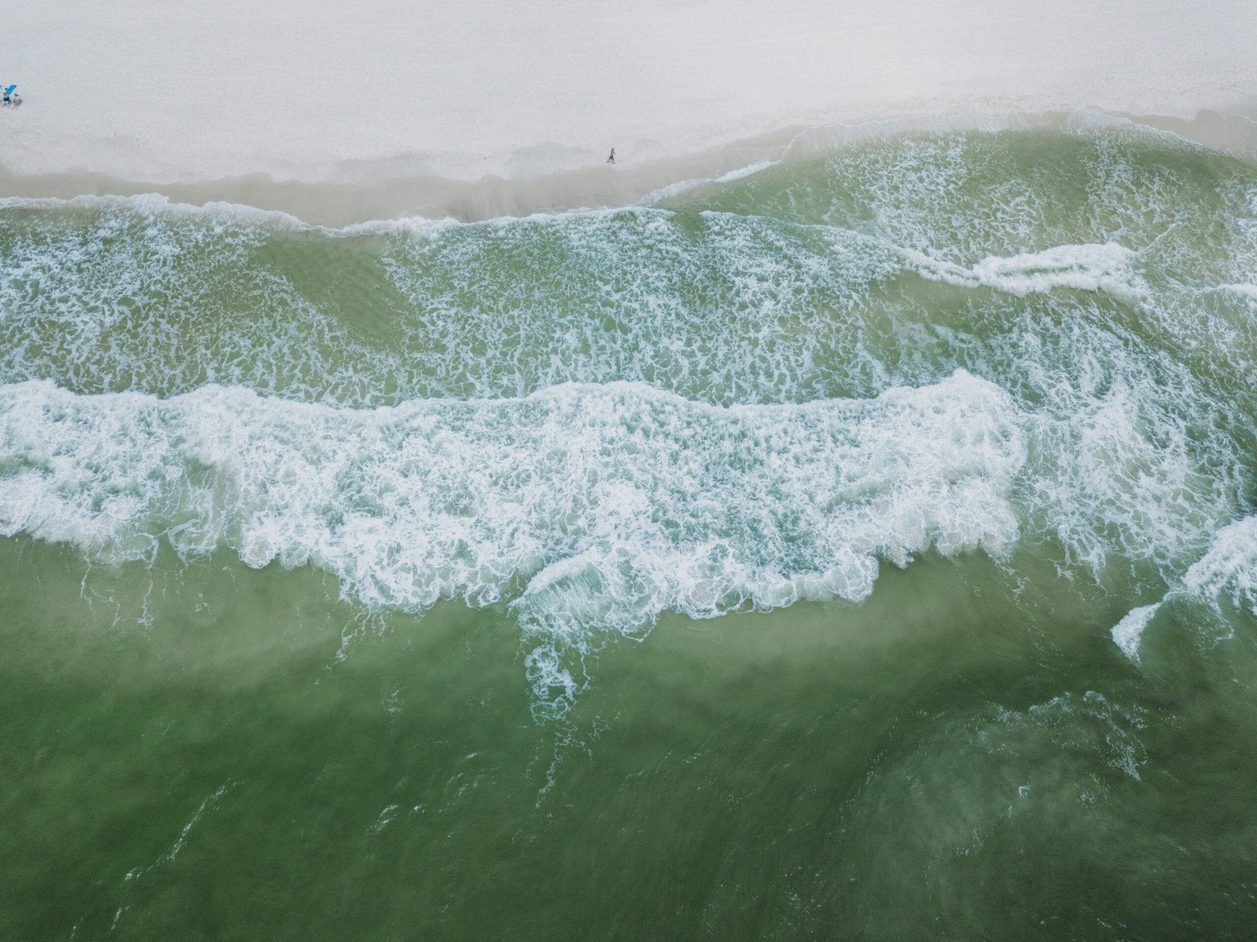 a person riding a surfboard on a wave in the ocean